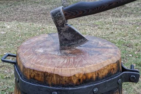 The axe stuck in the chopping block Stock Photos