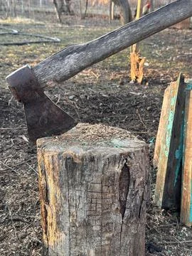 Axe in Stump at Sunset Stock Photos