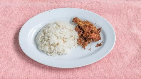 Ayam goreng Kalasan is a fried chicken dish with special spices originating.. Stock Photos