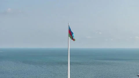Azerbaijan Flag Waving in Wind with Expansive Ocean Horizon View Stock Footage 341904018