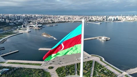 Azerbaijan Large National Flag Flutter with Cityscape and Ocean Panorama Stock Footage 341975040