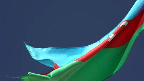 Azerbaijan three colored State Flag waving in the open blue sky Stock Footage 255007763