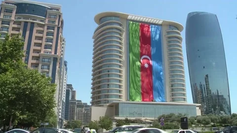 Azerbaijani Three Colored State flag Hanging over building Stock Footage 239329762