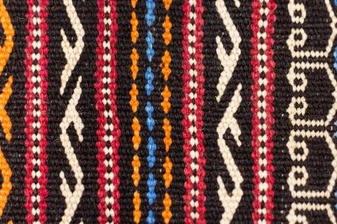 Aztec embroidered pattern color stitches blanket symmetry Foto stock