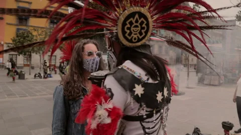 Aztec Shaman Doing a Cleanse with Smoke and Leaves to a Caucasian Woman Stock Footage 150438219