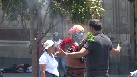 Aztec Using Incense On Tourist In Plaza De La Constitucion, Zocalo, Mexico City Stock Footage 154668491