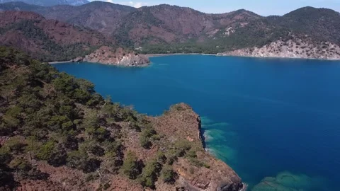 Azure bay with huge row mountain Stock Footage 195037198