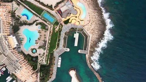 Azure bay ocean Top view drone footage Beach holidays swimming pools edge ocean Stock Footage 233595724