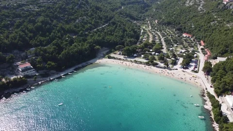 Azure Bliss: Captivating 4K Drone Panorama of Croatian Beach Stock Footage 246611062