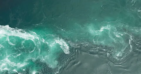 Azure blue currents, whirlpool and vortex in Saltstraumen maelstrom; drone Vidéo 246914725