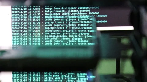 Azure computer software code moving on a black monitor reflect on glass. Abst Stock Footage 143871380