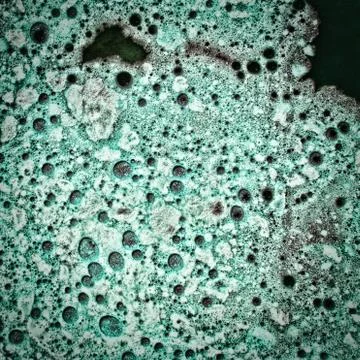 Azure foam and bubbles texture as abstract background. Stock Photos