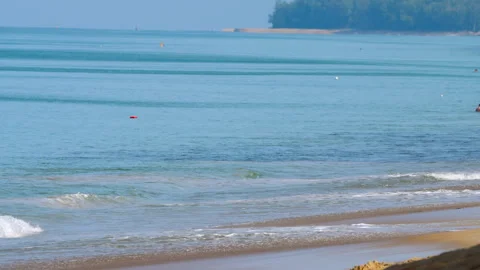 Azure sea wave rolling onto the beach Stock Footage 273508335
