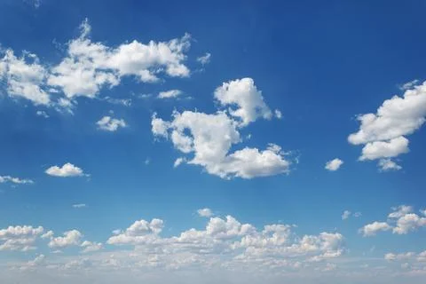 Azure sky with fluffy cumulus clouds, creating a calm natural landscape Stock Photos