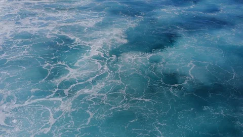The azure surface of the ocean video from a drone. Texture of the water surface  Stock Footage 127590392