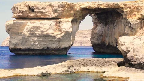 Azure Window, famous stone arch of Gozo island in the sun in summer, Malta Stock Footage 95493851