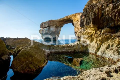 Azure Window, Famous Stone Arch On Gozo Island With Reflection, Malta