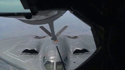 B-2 heavy stealth strategic bomber flies, refueling Video stock 121031807