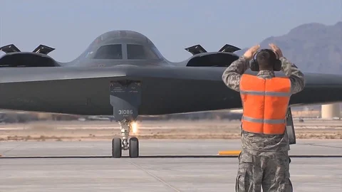 B-2 Stealth bomber directed for take off Stock Footage 109576274