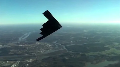 B-2 Stealth bomber in flight turning Stock Footage 109614586