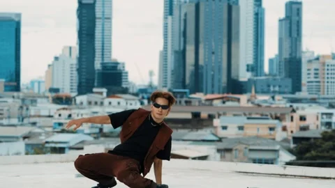 B-boy dance performance by professional street dancer at rooftop. hiphop. Stock Footage 258094859