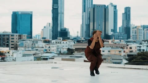 B-boy dance performance by professional street dancer at rooftop. hiphop. Stock Footage 263776616