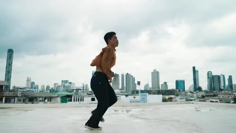B-boy dance performance by professional street dancer at rooftop. hiphop. Stock Footage 273196029