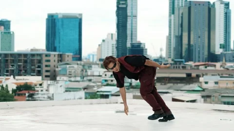 B-boy dance performance by professional street dancer at rooftop. hiphop. Stock Footage 275559467