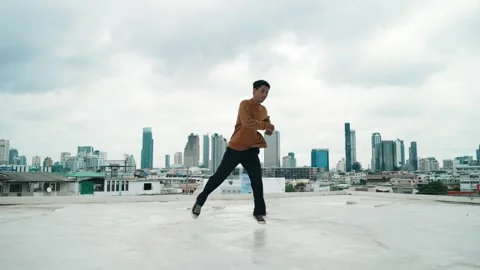 B-boy dance performance by professional street dancer at rooftop. hiphop. Stock Footage 275847062