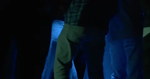 B-boy dances break-dance among crowd in dark night club 스톡 동영상 169631960