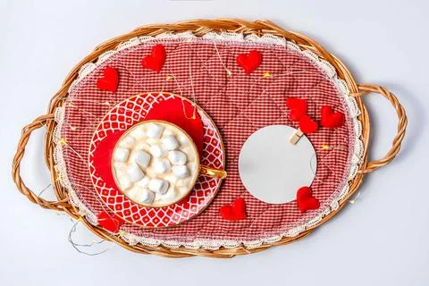 B raided tray with cup of cocoa with marshmallow. Decorated with small hearts Stock Photos