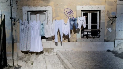 B-roll atmosphere shot of washing hanging on the side of a building Stock Footage 85739170