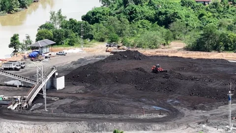 B-roll drone footage captures the daily operations at a large-scale coal st.. Stock Footage 342475231