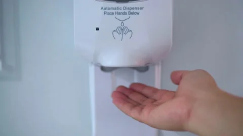 B roll of Hand using automatic touchless sanitizer dispenser Stock Footage 151433953