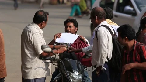 B-Roll shot of people walking and talking in the streets of Chennai, India Stock Footage 167576360