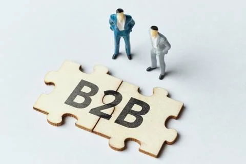 B2b concept with puzzle and two abstract persons Stock Photos