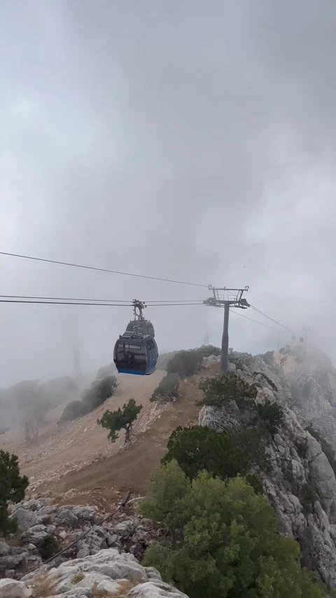 Babadag Cable car between clouds over the mountains Stock Footage 337129811