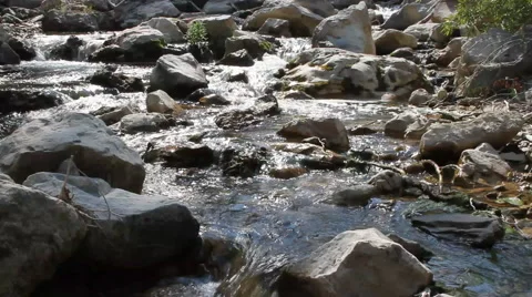 Babbling Brook flows through a rocky terrain Stock-Footage 40344313