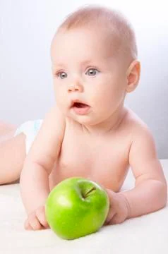 Babe and an apple #2 Stock Photos