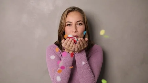 Babe blowing confetti Stock Footage 80252917