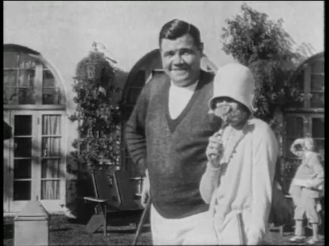 Babe Ruth playing golf with his wife on vacation 1930 archival footage Stock Footage 79010264
