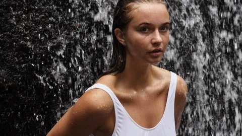 Babe under waterfall Stock Footage 94105729