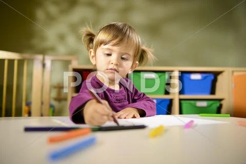 Babies and fun, child drawing at school Stock Photos