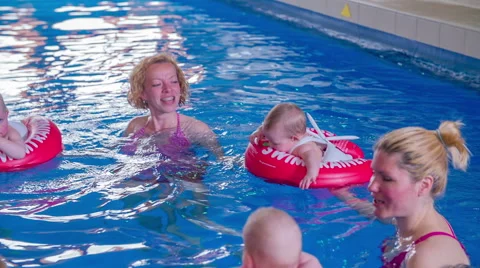 Babies and mother bathing Video stock 54075758