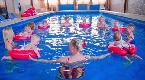 Babies and mother bathing in the pool Video stock 54075767