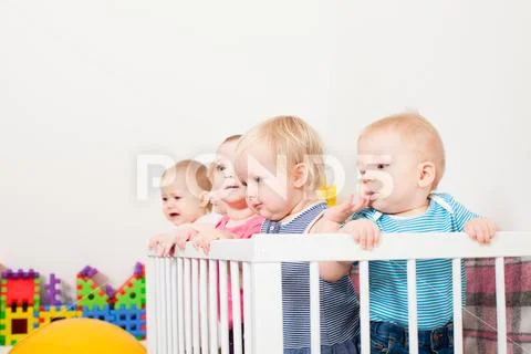 Babies in the crib Stock Photos