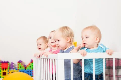 Babies in the crib Stock Photos