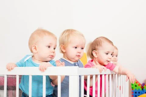Babies in the crib Stock Photos