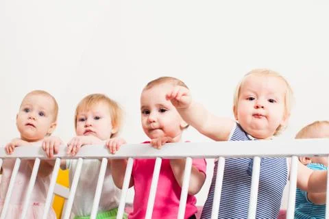Babies in the crib Stock Photos
