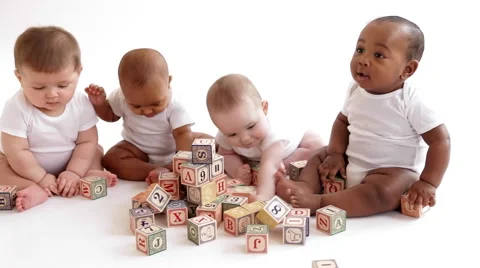 Babies playing with wooden blocks Stock Footage 58870742